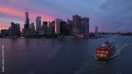 sunset flying right shot of downtown NYC and Staten Island ferry