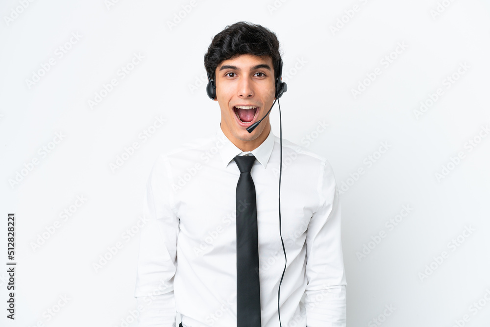Telemarketer man working with a headset isolated on white background with surprise facial expression Telemarketer man working with a headset isolated on white background with surprise facial expression