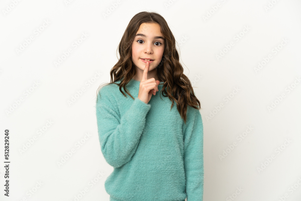 Little caucasian girl isolated on white background showing a sign of silence gesture putting finger in mouth Little caucasian girl isolated on white background showing a sign of silence gesture putting finger in mouth