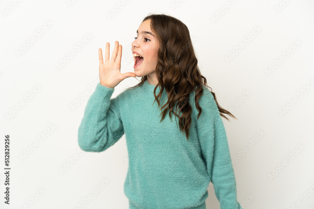 Little caucasian girl isolated on white background shouting with mouth wide open to the side Little caucasian girl isolated on white background shouting with mouth wide open to the side