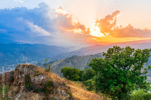 Mountain valley during sunset or sunrise. Natural spring or summer season landscape