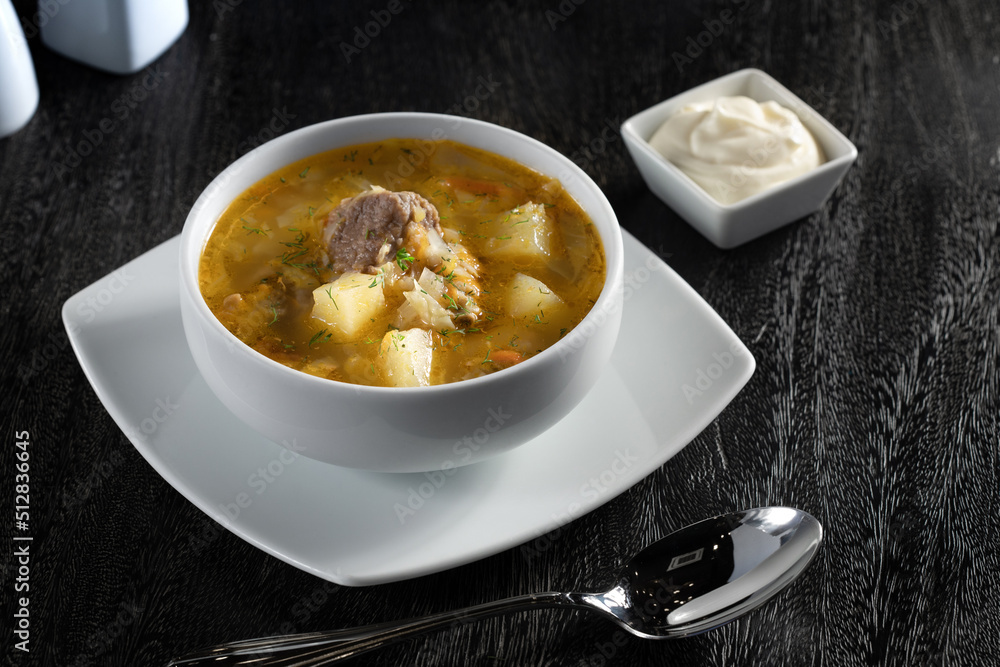 close up view of nice yummy vegetable soup on white back close up view of nice yummy vegetable soup on white back