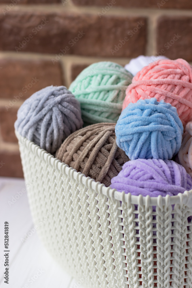 Plush yarn. Basket with tangles of thread. Knitting Day in Public Plush yarn. Basket with tangles of thread. Knitting Day in Public