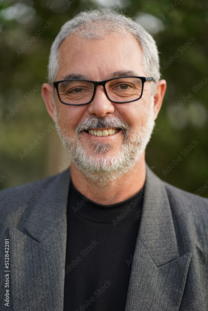 Senior professor in business suit smiling Senior professor in business suit smiling