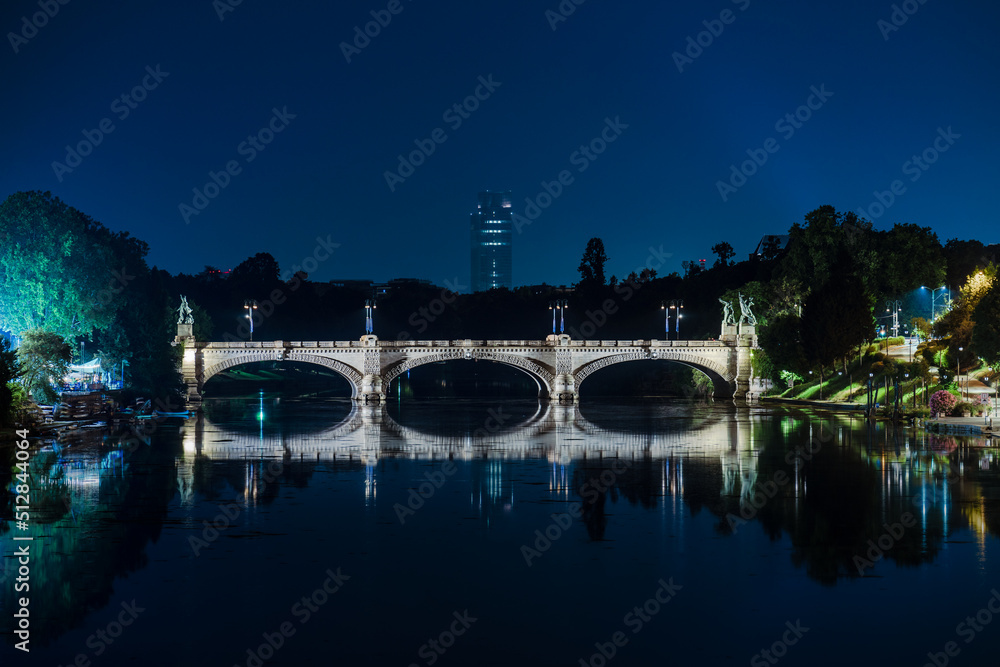Umberto I bridge over Po river in Turin at night