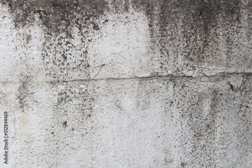 Peeling off the background paint grunge textured wall with black stains.