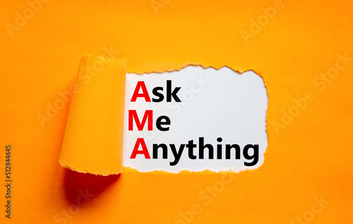 AMA ask me anything symbol. Concept words AMA ask me anything on white paper on a beautiful orange background. Business and AMA ask me anything concept. Copy space. photo
