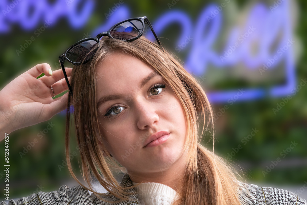 portrait of a beautiful young European girl, 16-17 years old, with long brown hair with a