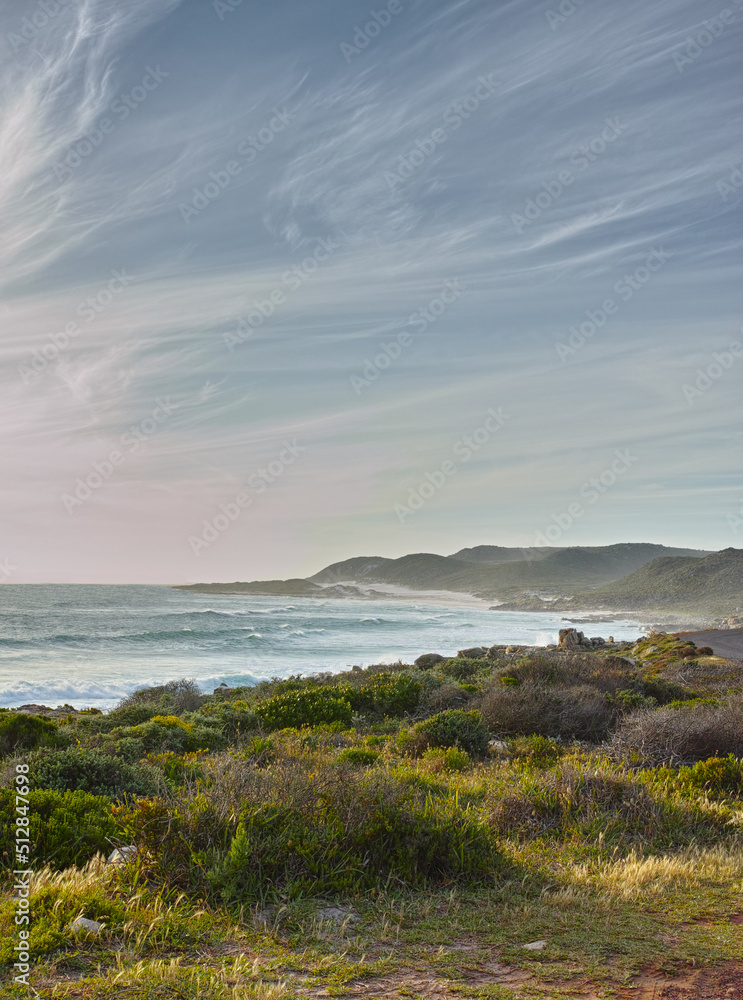 A view over the ocean in Cape Province, South Africa. Beauty in nature with the seascape of the ocean. Sky with clouds over the ocean on a summers day. Calm and serene nature scene with waves