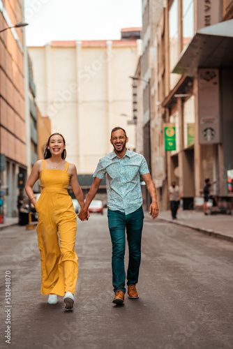 beautiful couple walking while holding hands