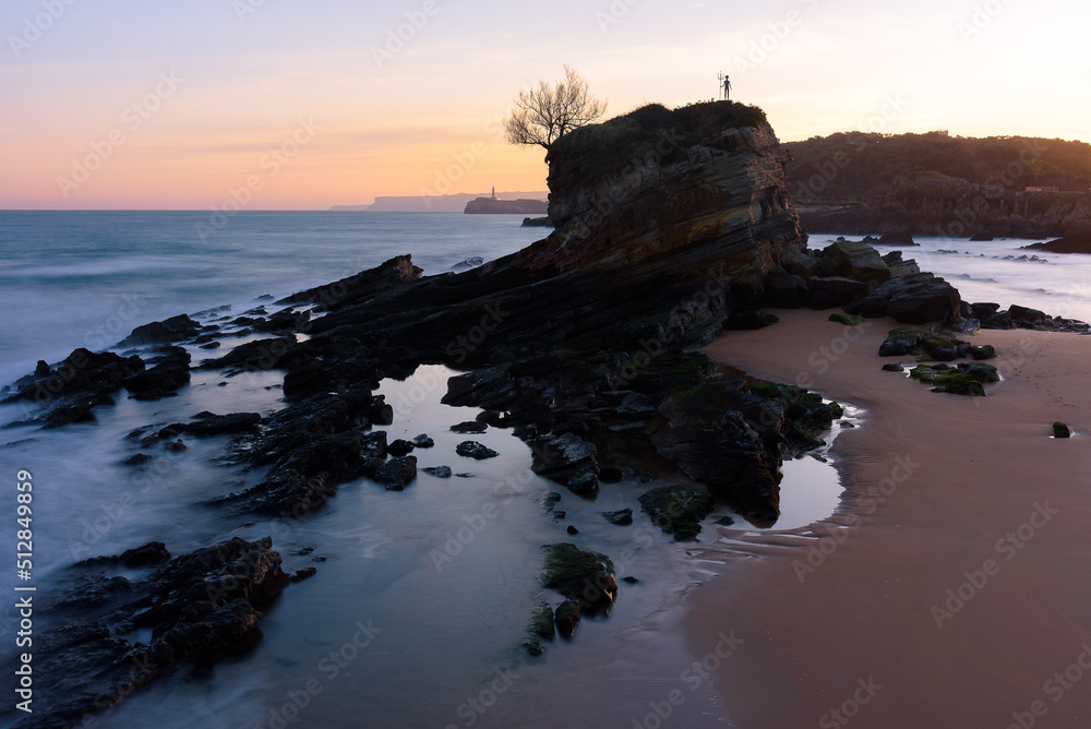 Beautiful view of the rock formation of Camello Beach at sunrise, Santander, Cantabria, Spain
