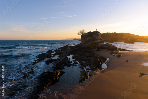Beautiful view of the rock formation of Camello Beach at sunrise, Santander, Cantabria, Spain