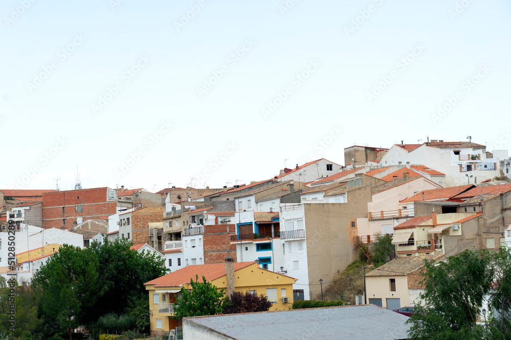 roofs of houses in the village under the blue sky
