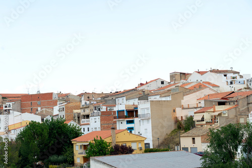 roofs of houses in the village under the blue sky