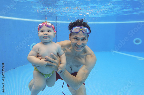 Underwater Baby swimming photo