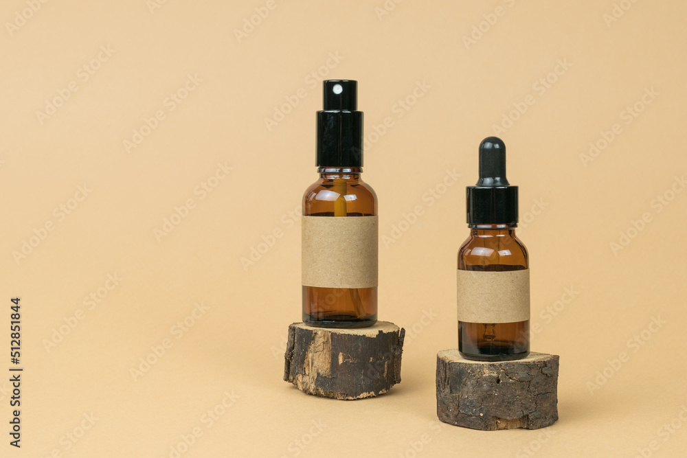 Two medical vials on pieces of sawn wood. Cosmetics and medicinal products based on natural minerals. Two medical vials on pieces of sawn wood. Cosmetics and medicinal products based on natural minerals.