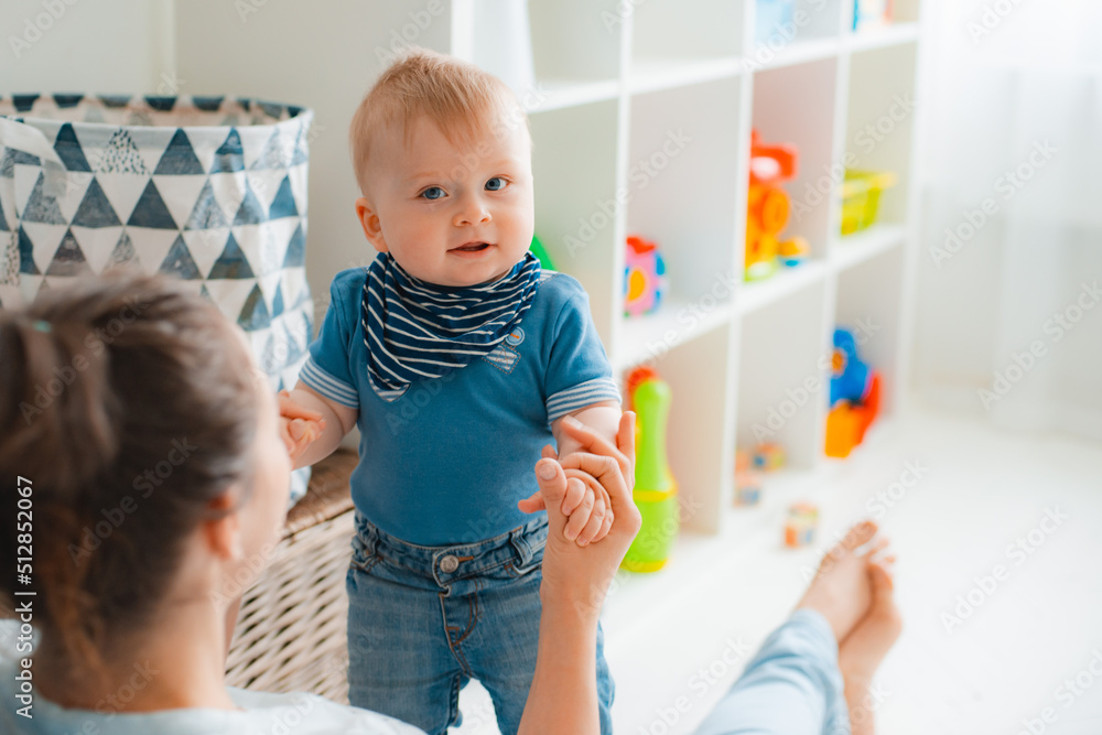 cute mother and child boy play together indoors at home cute mother and child boy play together indoors at home