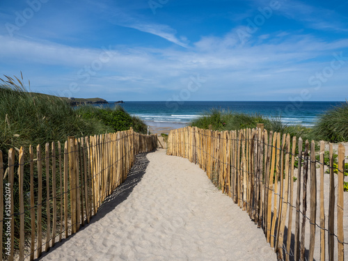 Pathway through the sand dunes to Fistral Beach at Newquay in Cornwall. photo