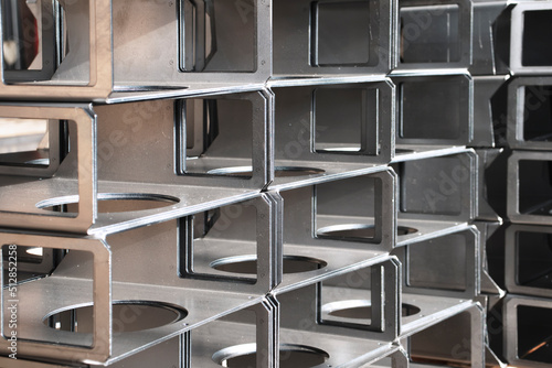 Sheet steel metal products bent on a CNC bending machine, metalworking close-up in a factory photo