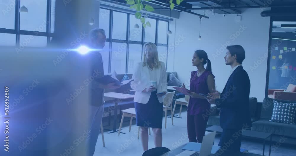 Animation of light spots over diverse business people talking Animation of light spots over diverse business people talking