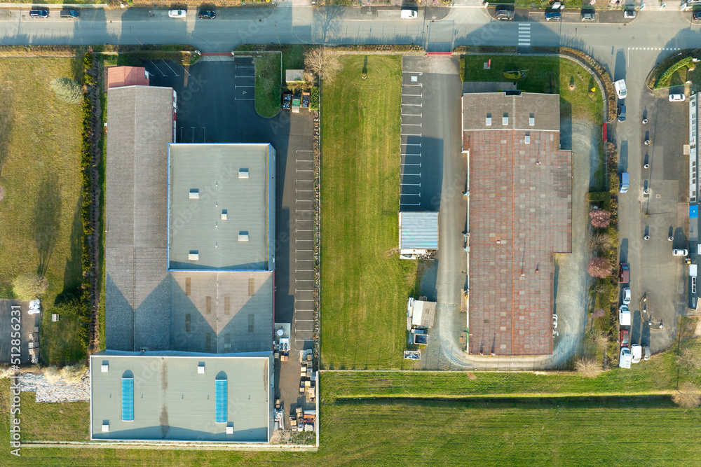 Aerial view of modern factory structure for production and distribution of industrial equipment. Concept of global industry Aerial view of modern factory structure for production and distribution of industrial equipment. Concept of global industry