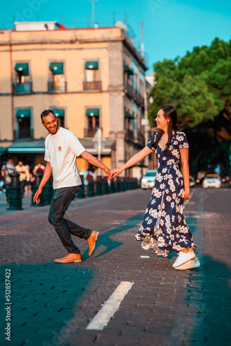 portrait of a beautiful couple crossing the street