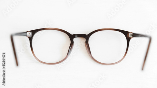 Round optical glasses on a white background