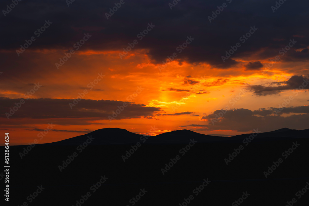 Fototapeta premium Sunrise or sunset over the hills or mountains. Morning or evening background