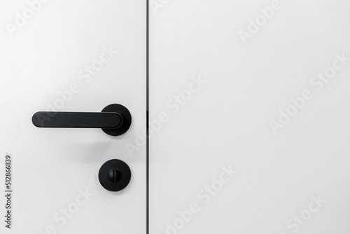 Black handle with lock on entrance door in living room