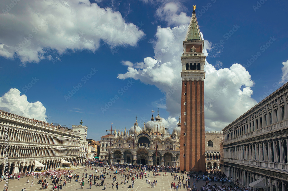 Venice, Italy - September 02, 2018: Saint Mark square, basilica, bell tower and square with crowd of people and tourists, blue sky in a sunny summer day