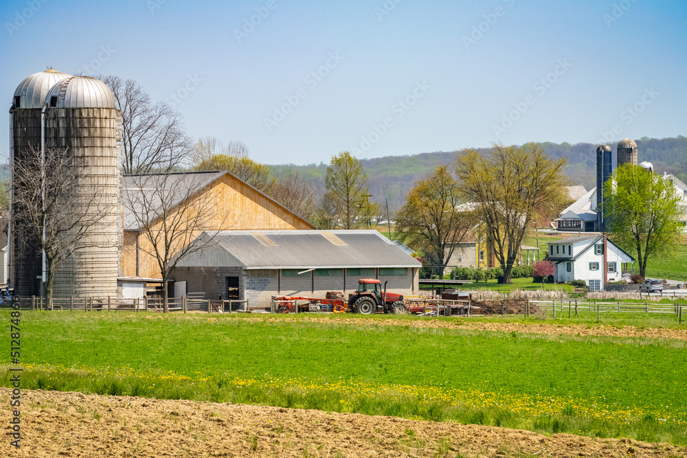 Amish country, farm, home and barn on field agriculture in Lancaster, Pennsylvania, PA US North America