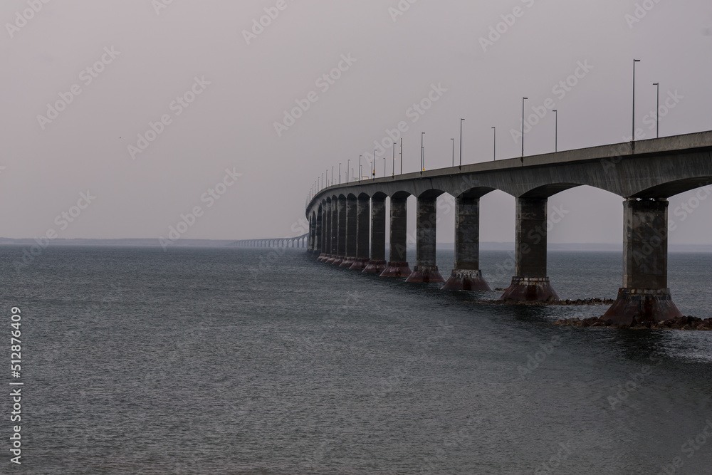 Confederation Bridge, a box girder bridge, the longest bridge on ice-covered water in Canada. It links Prince Edward Island to New Brunswick at Northumberland Strait and costed C$1.3 billion.