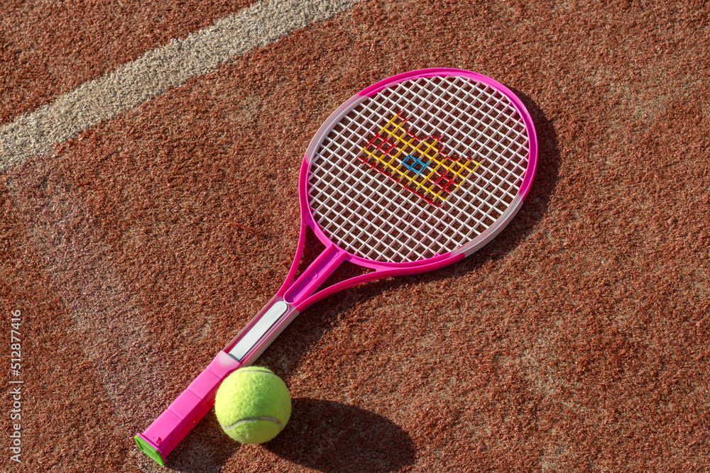 Tennis game. Tennis ball with racket on the tennis court. The concept of sports, recreation