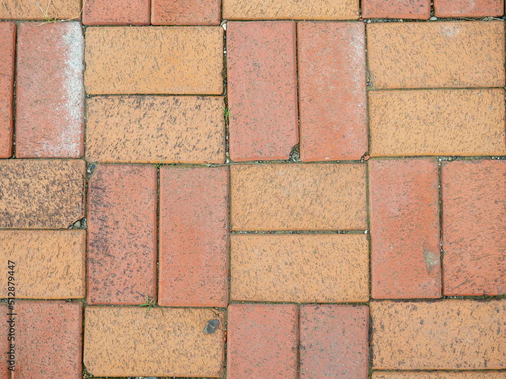 Fototapeta premium Old brickwork. Bricks on the ground. Construction works. Brick block. Demolition work. Stones on the ground.