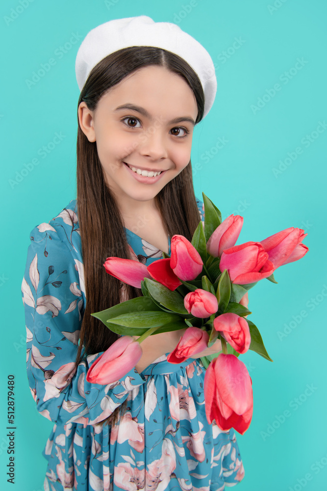 happy child face in beret with tulips. mothers or womens day. kid hold flowers for 8 of march. happy child face in beret with tulips. mothers or womens day. kid hold flowers for 8 of march.