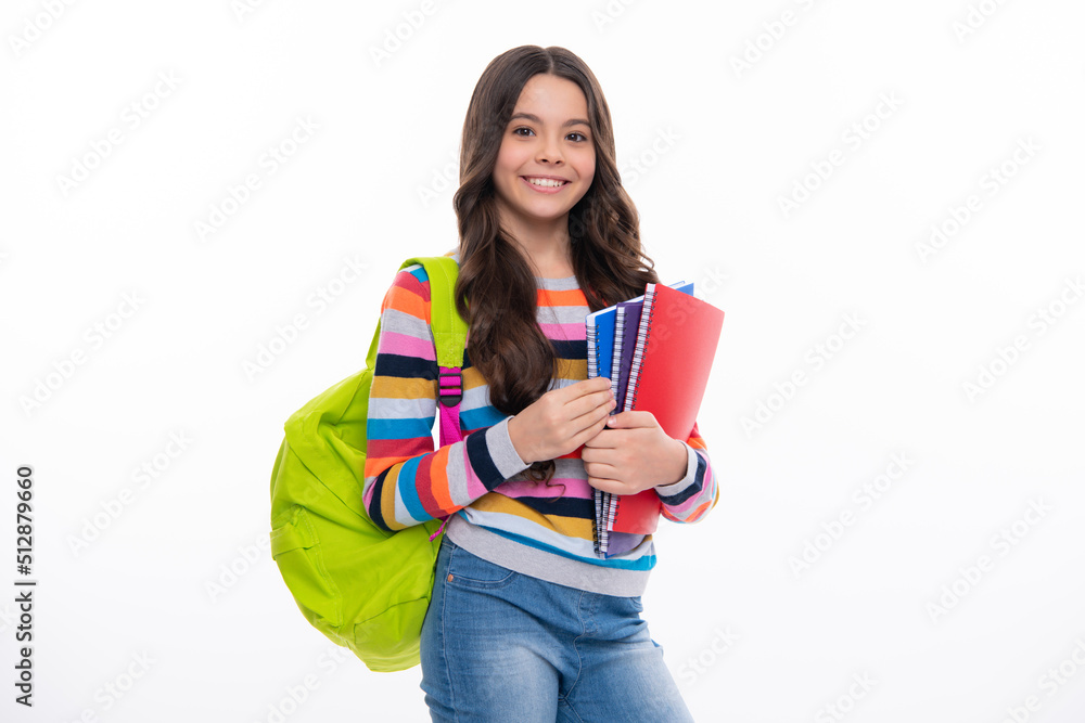 Schoolchild, teenage student girl with school bag backpack hold book on white isolated studio background. Children school and education concept. Happy girl face, positive and smiling emotions. - obrazy, fototapety, plakaty 