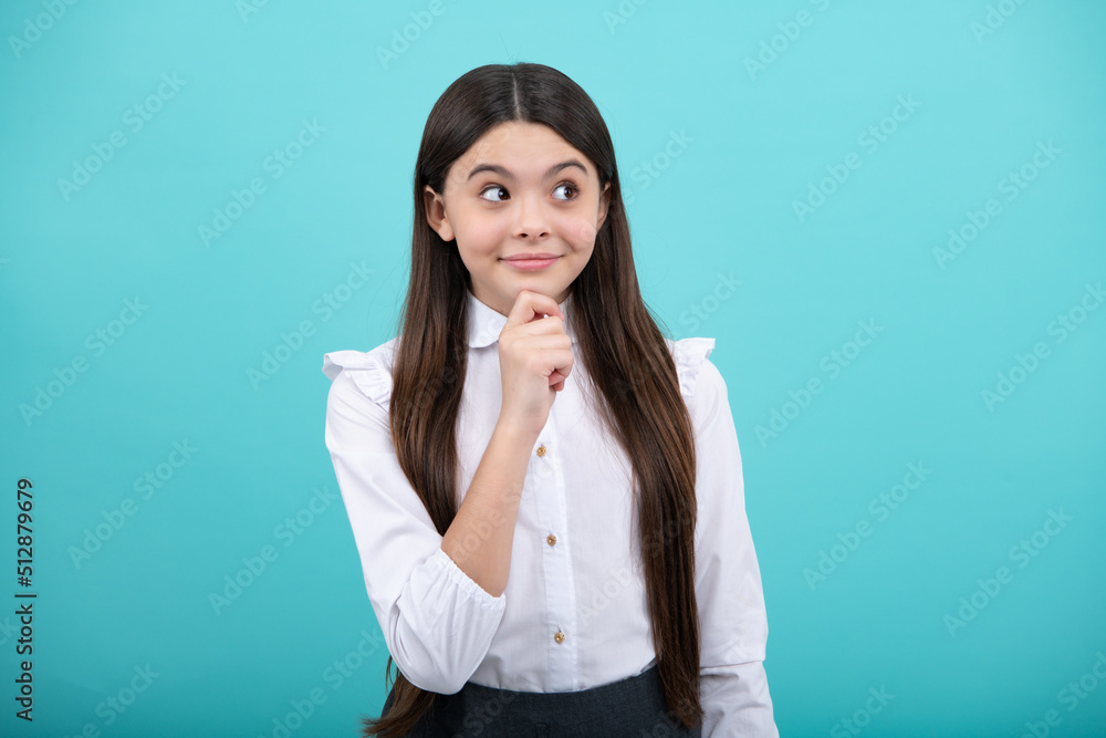 Thinking teenager girl, thoughtful emotion. Children studio portrait on blue background. Childhood lifestyle concept. Cute teenage girl face close up. Thinking teenager girl, thoughtful emotion. Children studio portrait on blue background. Childhood lifestyle concept. Cute teenage girl face close up.