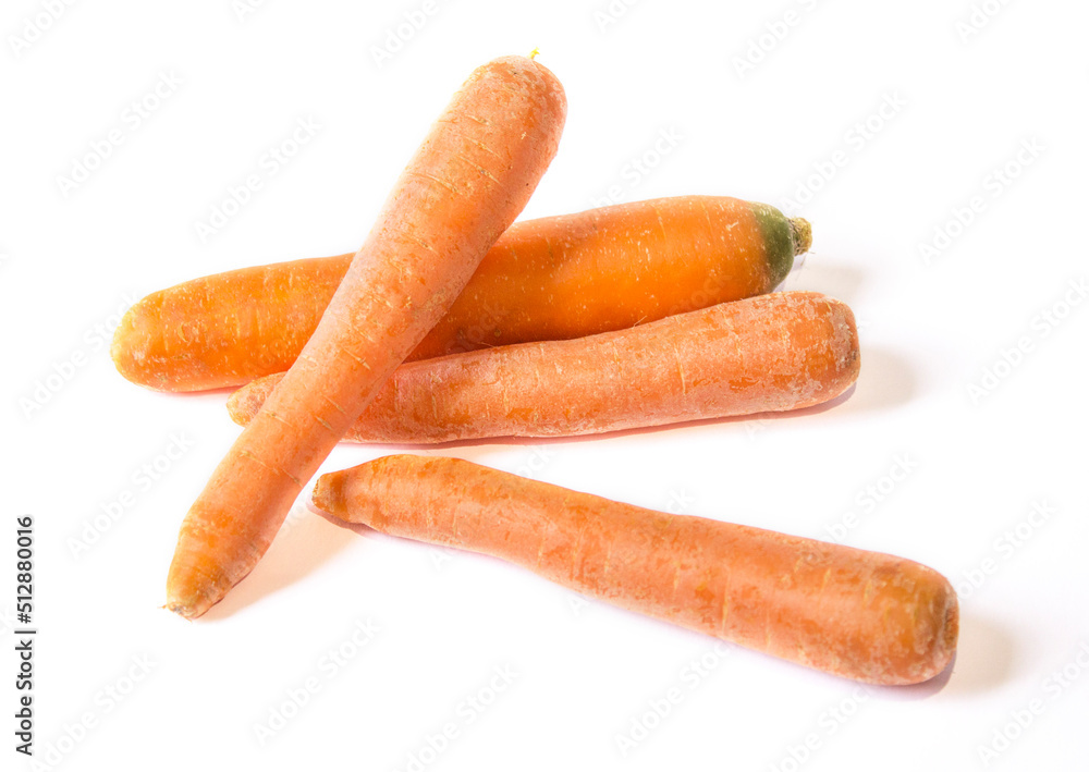 several carrots are lying on a white background several carrots are lying on a white background