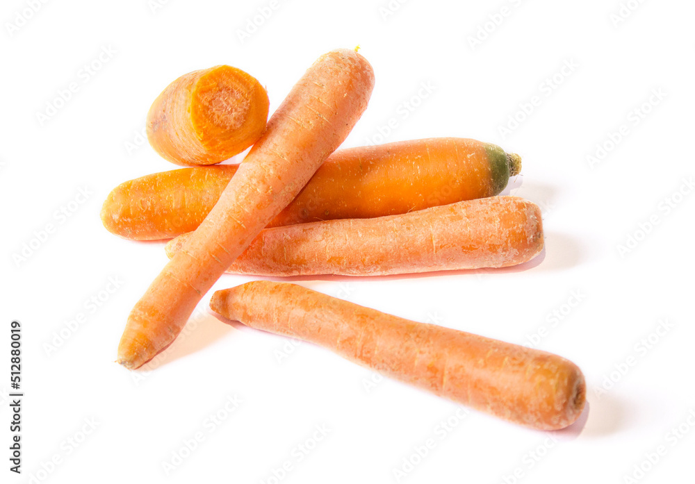 several carrots are lying on a white background several carrots are lying on a white background