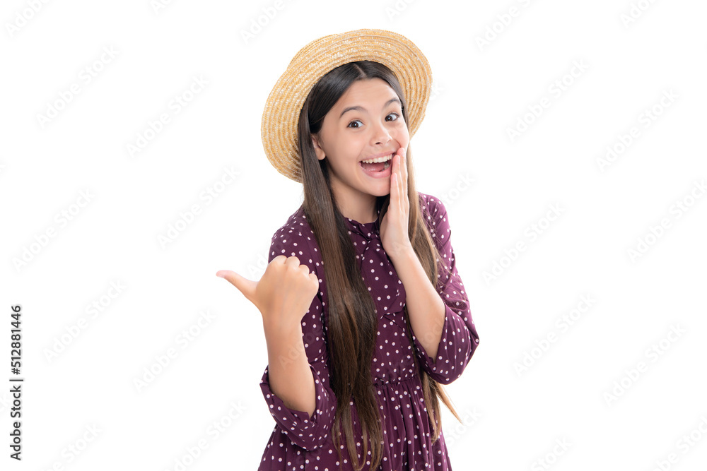 Teenager child pointing to the side with a finger to present a product or idea. Teen girl in casual outfit pointing empty space. Portrait of emotional amazed excited teen girl.