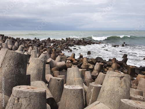 The breakwater structure on the yogyakarta beach indonesia photo