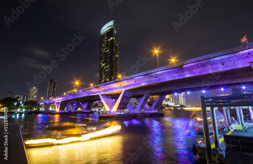 Khlong San Bang Rak Sathorn Bangkok Thailand on April 15 2019 Illumination of King Taksin Bridge Sathorn Bridge  and Bangkok skyline.
