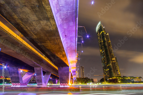 Photography Khlong San,Bang Rak,Sathorn,Bangkok,Thailand on April 15,2019:Illumination of King Taksin Bridge(Sathorn Bridge) and Bangkok skyline