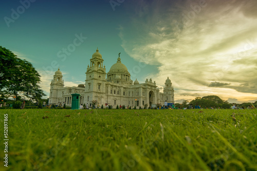 Kolkata, West Bengal, India - July 16th 2017 : Beautiful image of sun set with Victoria Memorial buliding - a landmark public buiding of Kolkata, famous tourist attraction.