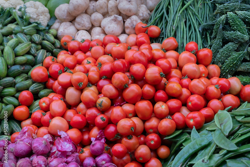 Fototapeta Naklejka Na Ścianę i Meble -  Tomato and other vegetables for sale in a market in Territy Bazar, Kolkata, West Bengal, India.
