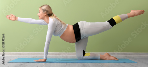 Young pregnant woman doing ...