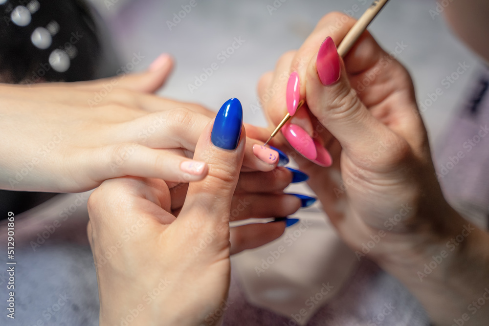 the manicure process of a teenage girl in close-up the manicure process of a teenage girl in close-up