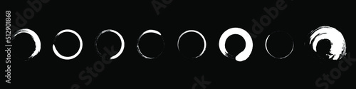 Set of grunge circle brush strokes. White round frames. Elements for design. Vector illustration isolated on black background. EPS 10