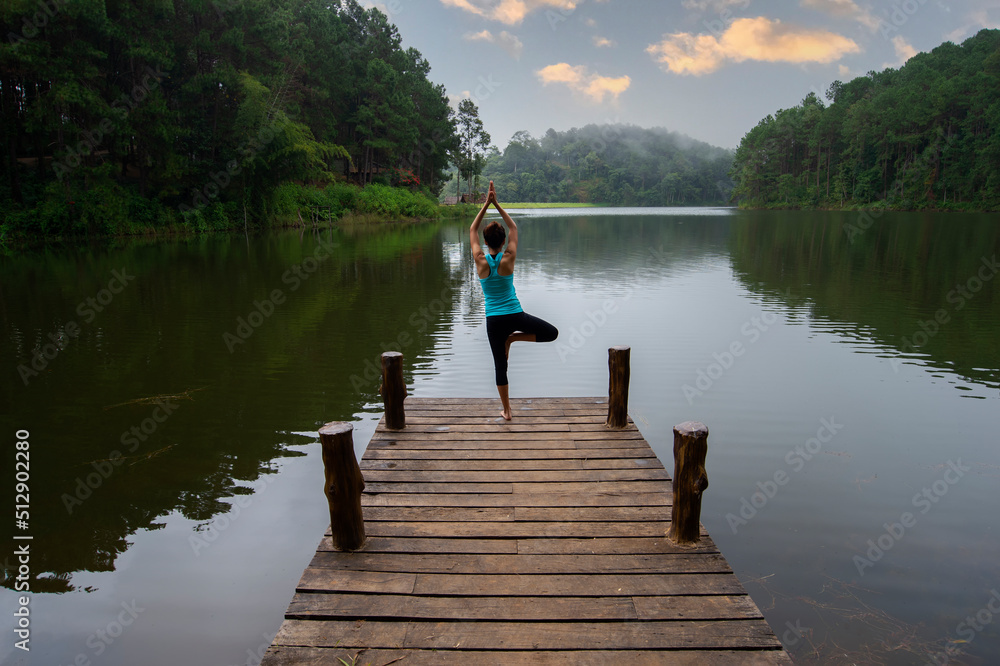 Yoga Young girl or people pose balance body vital zen meditation for workout nature mountain background in morning sunrise.Lifestyle woman yoga exercise and pose for healthy life.