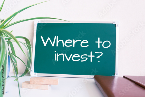 Fotografie, Tablou Text Where to invest? written on the green chalkboard